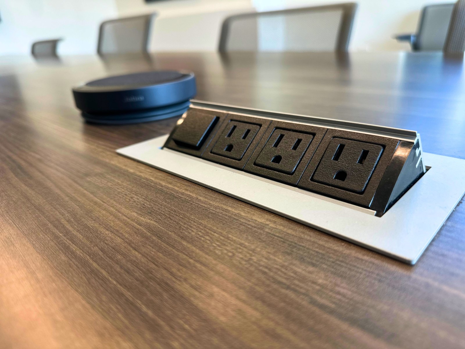 Conference table power outlets and speakerphone at SpringPad in Lincoln, Nebraska