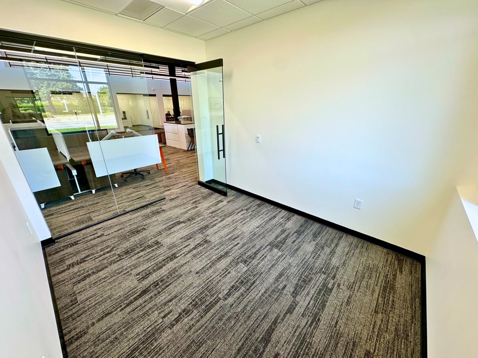 Empty unfurnished private office with a window at SpringPad in Lincoln, Nebraska