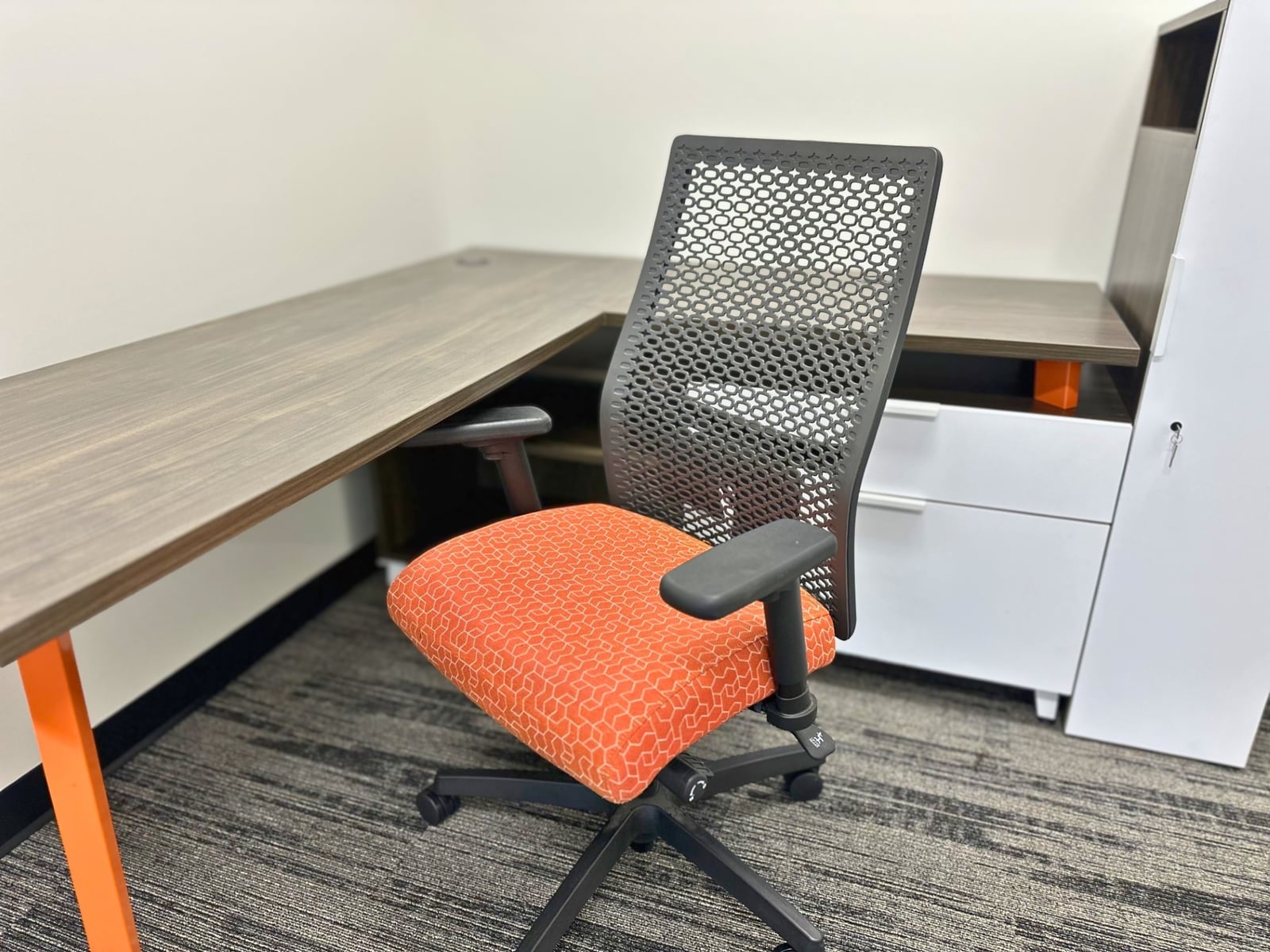 Desk, task chair and lockable storage included in a furnished office at SpringPad in Lincoln, Nebraska