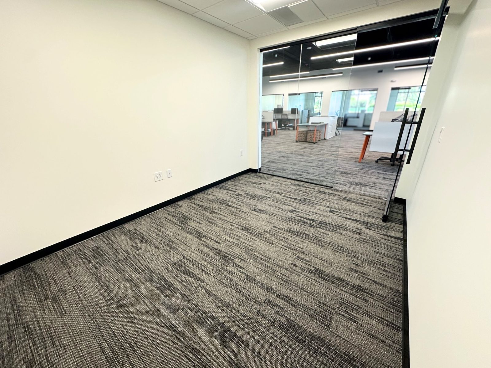 A second view of an unfurnished interior private office at SpringPad in Lincoln, Nebraska